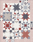 Quilt featuring different star blocks in red, white, and blue.