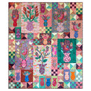 Colorful patchwork quilt with floral and abstract patterns on a white background